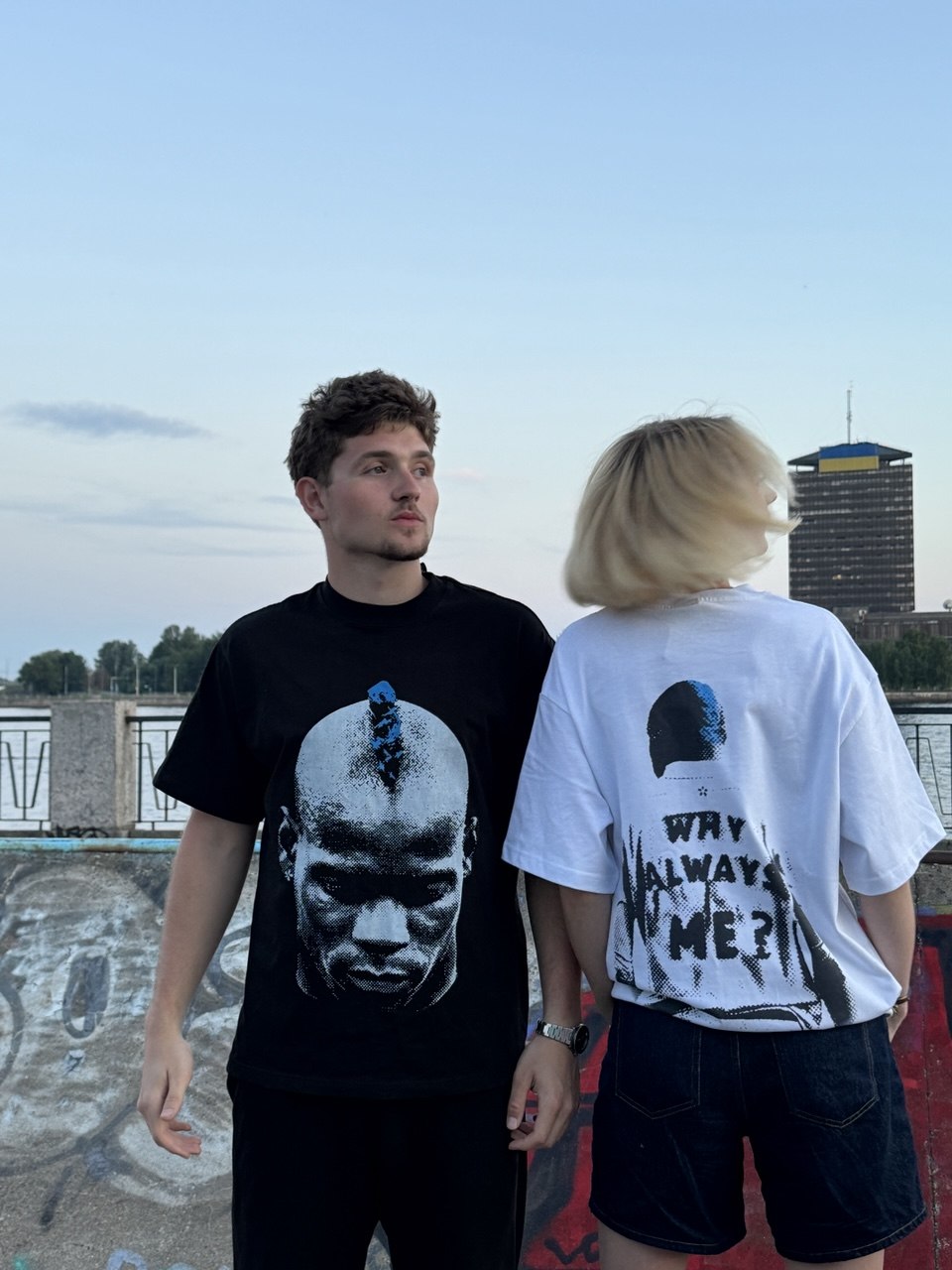 Striker Club Drop 01 — model in oversized football jersey on urban pitch